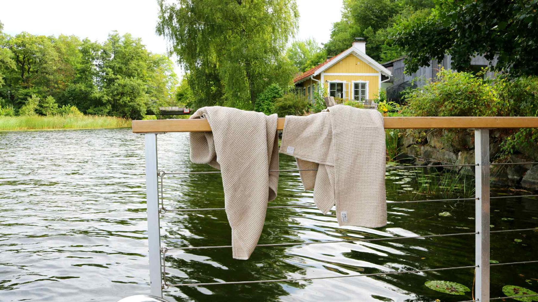 Linen towels by lake